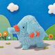 Phanpy made out of wool, in a lovely bucolic backdrop.
